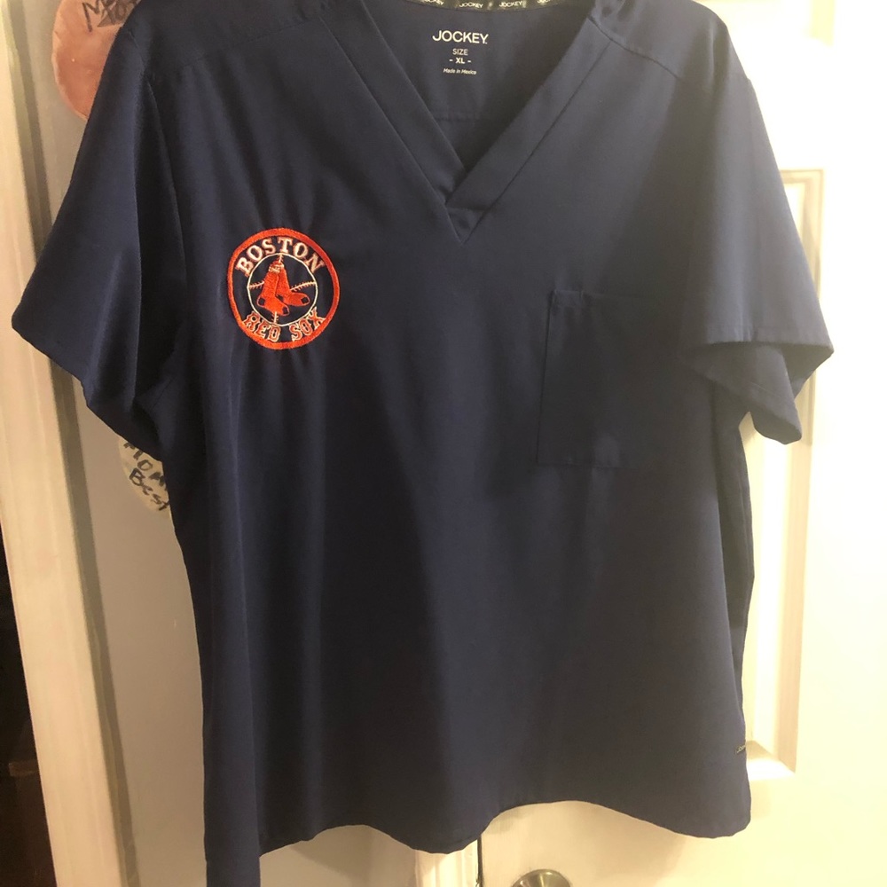 Scrub top. Men’s fit. I had the Red Sox logo made and put on.